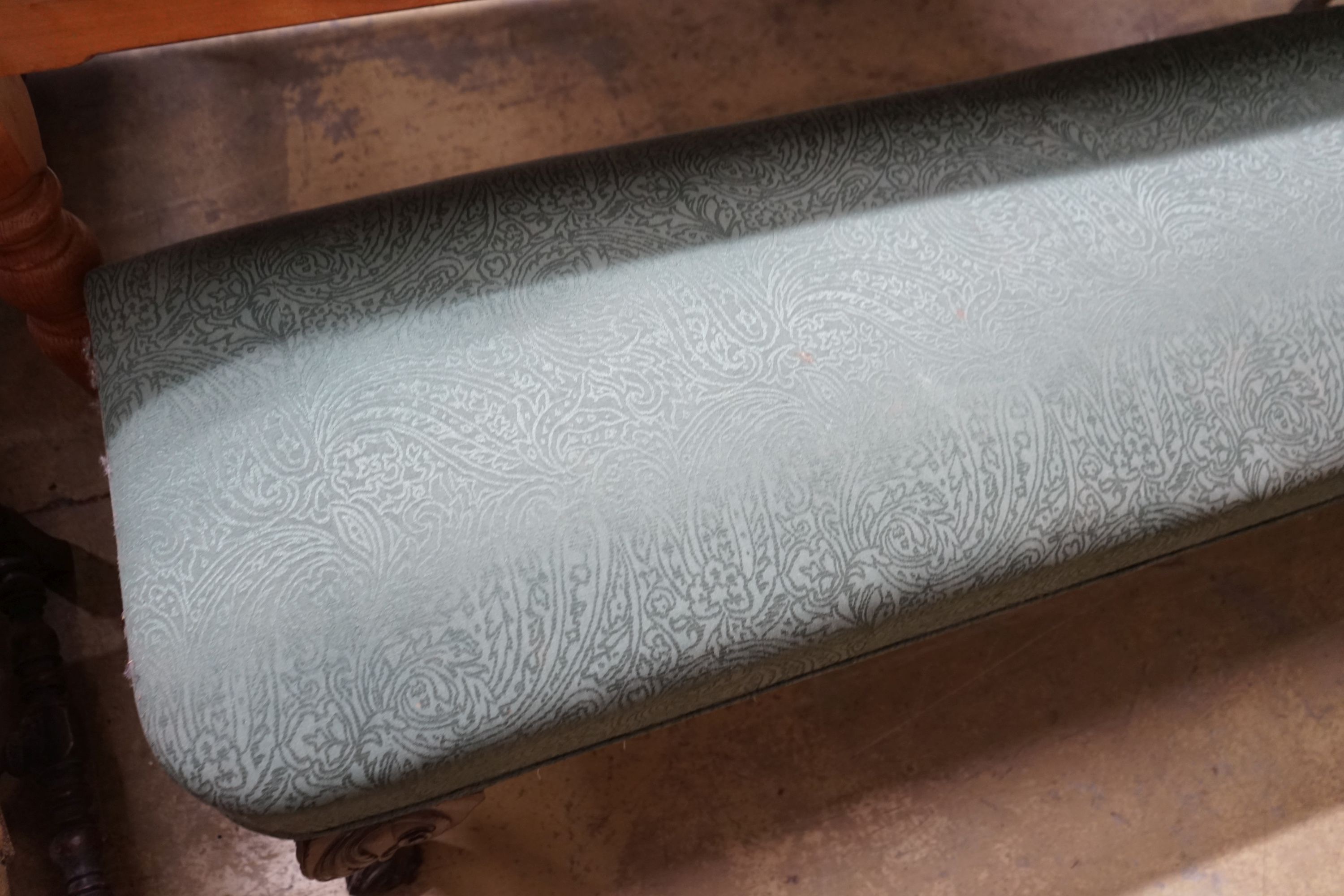 A George II style upholstered window seat on carved cabriole legs, length 168cm, depth 46cm, height 48cm